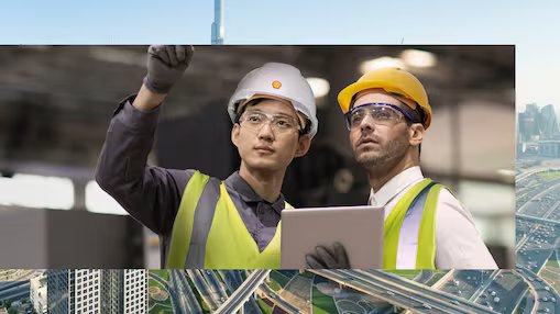 Shell worker consulting an industry worker on site