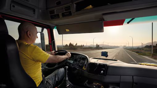 truck driver driving on empty road